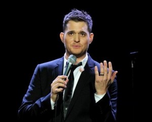 Michael Buble showing an audience his engagement ring in 2009.