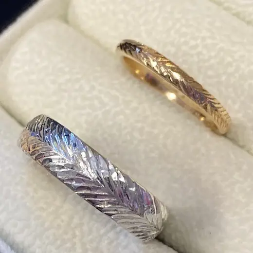 Patterned wedding rings in a ring box